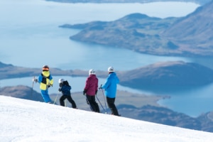 Skiers looking down to Lake Wanaka